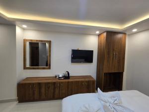 TV a/nebo společenská místnost v ubytování Hotel Kavaana