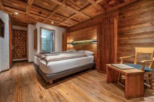 Postel nebo postele na pokoji v ubytování Hôtel Le Grand Chalet
