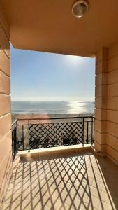 a balcony with a view of the ocean at Hotel Brilant in Shëngjin +20 photos
