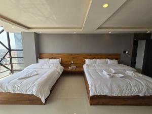 Postel nebo postele na pokoji v ubytování Hotel Kavaana