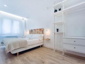 A bed or beds in a room at AKURA apartment, con aire acondicionado