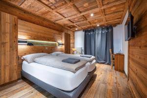 Postel nebo postele na pokoji v ubytování Hôtel Le Grand Chalet