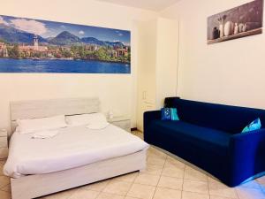 En eller flere senge i et værelse på Gigi House