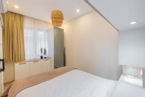 Katil atau katil-katil dalam bilik di Rose 1 Fantastic 1+1 with private terrasse +14 gambar