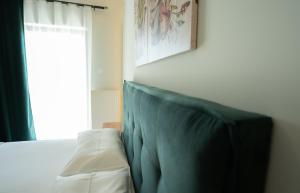 A bed or beds in a room at Meteora House with a view