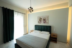 A bed or beds in a room at Meteora House with a view