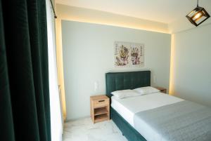 A bed or beds in a room at Meteora House with a view