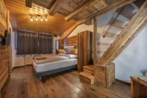 Postel nebo postele na pokoji v ubytování Hôtel Le Grand Chalet