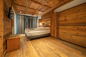 Postel nebo postele na pokoji v ubytování Hôtel Le Grand Chalet