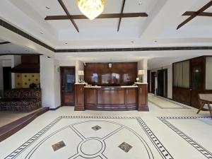 a large room with a lobby with a table at Hotel Supreme Suites I B2B Friendly I Ludhiana in Ludhiana