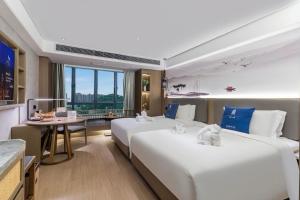 Foto sihtkohas Guangzhou asuva majutusasutuse LIZ International Hotel Guangzhou Olympic Sports Center International Financial City Branch - Free Shuttle Bus to Canton Fair Complex During Canton Fair Period & Free Breakfast & Free Afternoon Tea & Free Midnight Snack galeriist