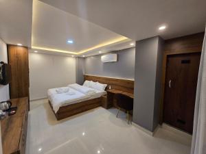 Postel nebo postele na pokoji v ubytování Hotel Kavaana
