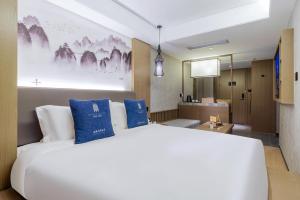 Foto sihtkohas Guangzhou asuva majutusasutuse LIZ International Hotel Guangzhou Olympic Sports Center International Financial City Branch - Free Shuttle Bus to Canton Fair Complex During Canton Fair Period & Free Breakfast & Free Afternoon Tea & Free Midnight Snack galeriist