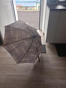 an open umbrella sitting on the floor in a room at La Lunita in Valverde