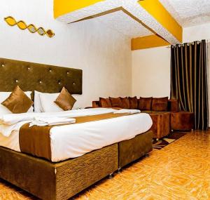 Postel nebo postele na pokoji v ubytování Nur Complex Hotel & Apartment