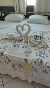 Una cama o camas en una habitación de Hotel União