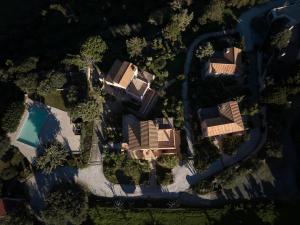 an overhead view of a house with a swimming pool at Eliathos Hillside Retreat in Archanes