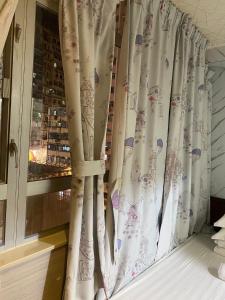 A bed or beds in a room at 富都賓館 Fu Dou Guest House