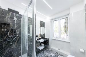 Koupelna v ubytování Teulada Luxury Rooms