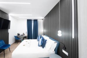 Postel nebo postele na pokoji v ubytování Teulada Luxury Rooms