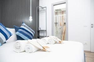 Postel nebo postele na pokoji v ubytování Teulada Luxury Rooms