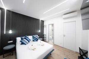Postel nebo postele na pokoji v ubytování Teulada Luxury Rooms