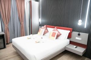 Postel nebo postele na pokoji v ubytování Teulada Luxury Rooms
