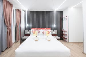 Postel nebo postele na pokoji v ubytování Teulada Luxury Rooms