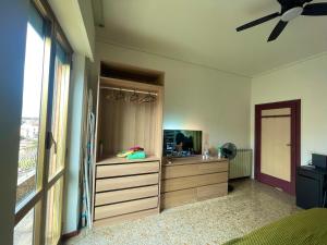 a bedroom with a bed and a dresser and a window at Private and quiet room in Rome +15 photos