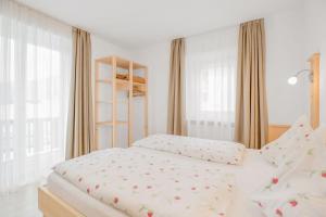 Postel nebo postele na pokoji v ubytování Residence krUma