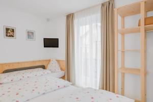 Postel nebo postele na pokoji v ubytování Residence krUma