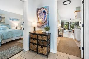 a bedroom with a bed and a table with a night stand at 55-2 Low Country Get-A-Way condo in Pawleys Island