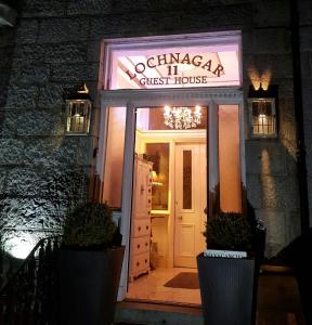 a front door of a guest house at night at Lochnagar Guest House in Aberdeen