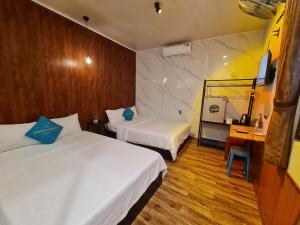 Ein Bett oder Betten in einem Zimmer der Unterkunft Banana homestay( Chuối Homestay)