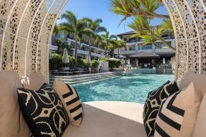 a view of a swimming pool at a resort at Luxury Romance - 5 to Beach in Casuarina