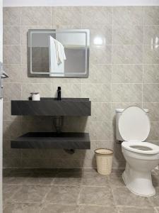 Koupelna v ubytování Hôtel Hawaii