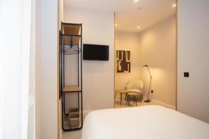 Posteľ alebo postele v izbe v ubytovaní Chinitas Urban Rooms