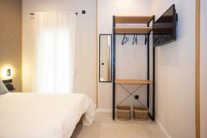 Posteľ alebo postele v izbe v ubytovaní Chinitas Urban Rooms