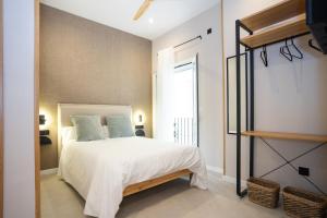 Posteľ alebo postele v izbe v ubytovaní Chinitas Urban Rooms