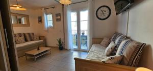 Posezení v ubytování Appartement VOILES BLANCHES-Clim-Wifi-Plage a pieds