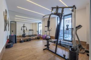 a gym with several tread machines in a room at Camelia 9 in Alanya