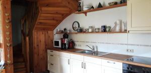 Kuchyň nebo kuchyňský kout v ubytování 75 qm Ferienwohnung für 4 Personen am Naturschutzgebiet Anklamer Stadtbruch + 7 fotografií