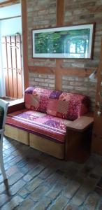 a couch sitting in the corner of a room at 75 qm Ferienwohnung für 4 Personen am Naturschutzgebiet Anklamer Stadtbruch in Bugewitz +3 photos