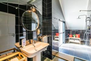 a bathroom with a sink and a shower at Emporium Lisbon Suites in Lisbon +45 photos