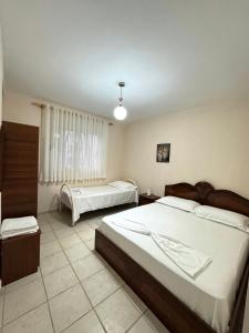 Postel nebo postele na pokoji v ubytování Sea House Durres