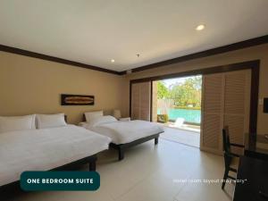 Postel nebo postele na pokoji v ubytování Coralpoint Gardens Suites & Residences + 37 fotografií