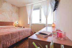 Posteľ alebo postele v izbe v ubytovaní CameliaLoft