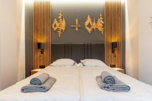 Giường trong phòng chung tại Apartament Grzegorzewska