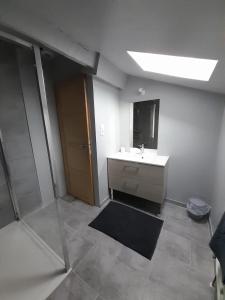a bathroom with a sink and a mirror at Maison bourguignonne in Lugny +23 photos
