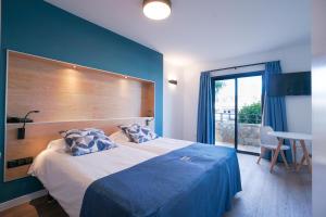 Postel nebo postele na pokoji v ubytování Playitas Hotel - Sports Resort
